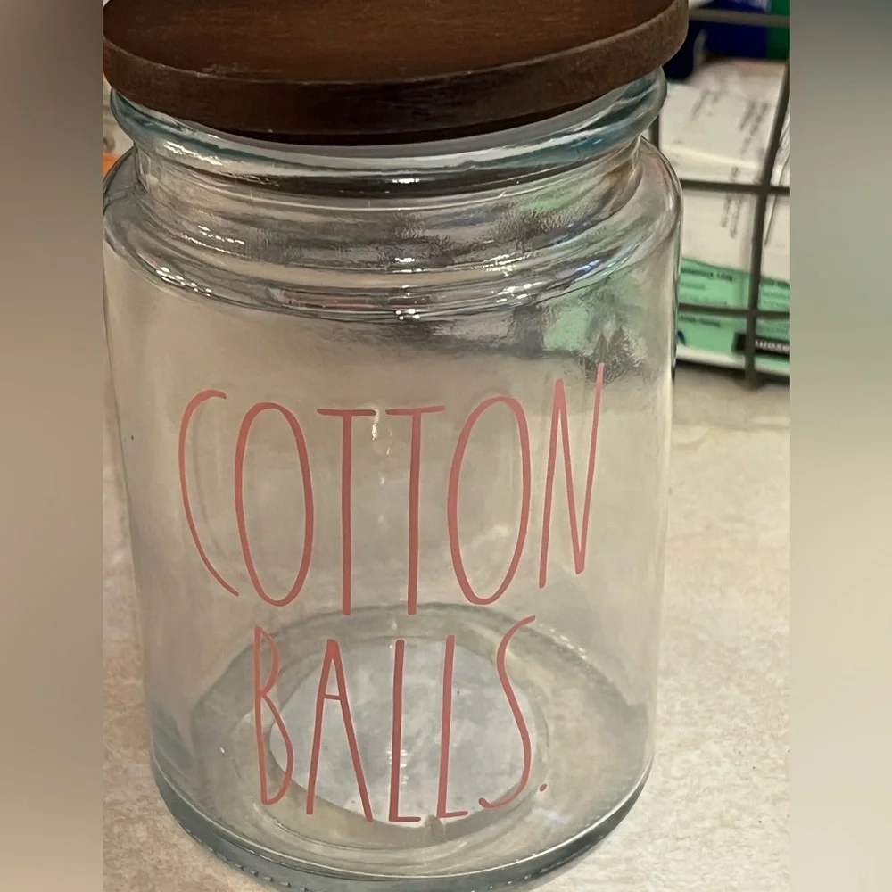 Rae Dunn glass‎ with wood lid container with red lettering “COTTON BALLS”